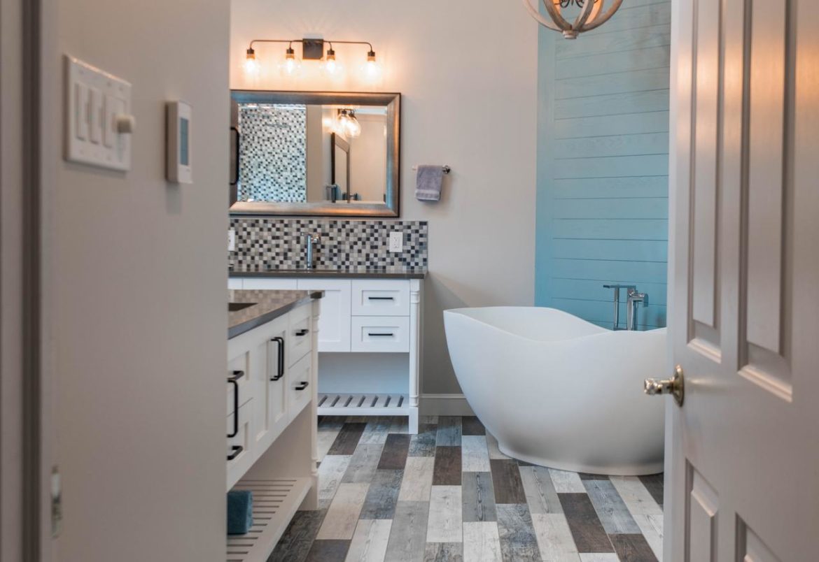 Doylestown, PA master bath remodel with wood accents, texture variation, and ambient lighting.